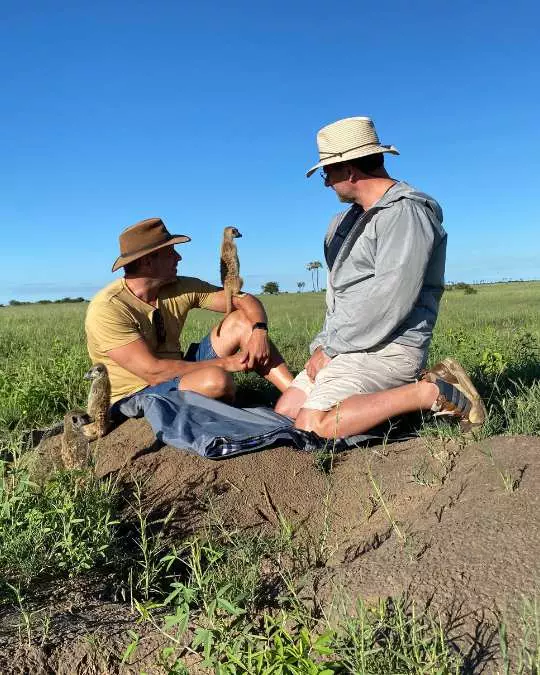 Nanan Travel - Balancing Luxury & Wilderness in African Safaris _ Ultimate Guide (11) Nanan Travel - Balancing Luxury & Wilderness in African Safaris _ Ultimate Guide-German and Jan with meercats on safari in Botswana