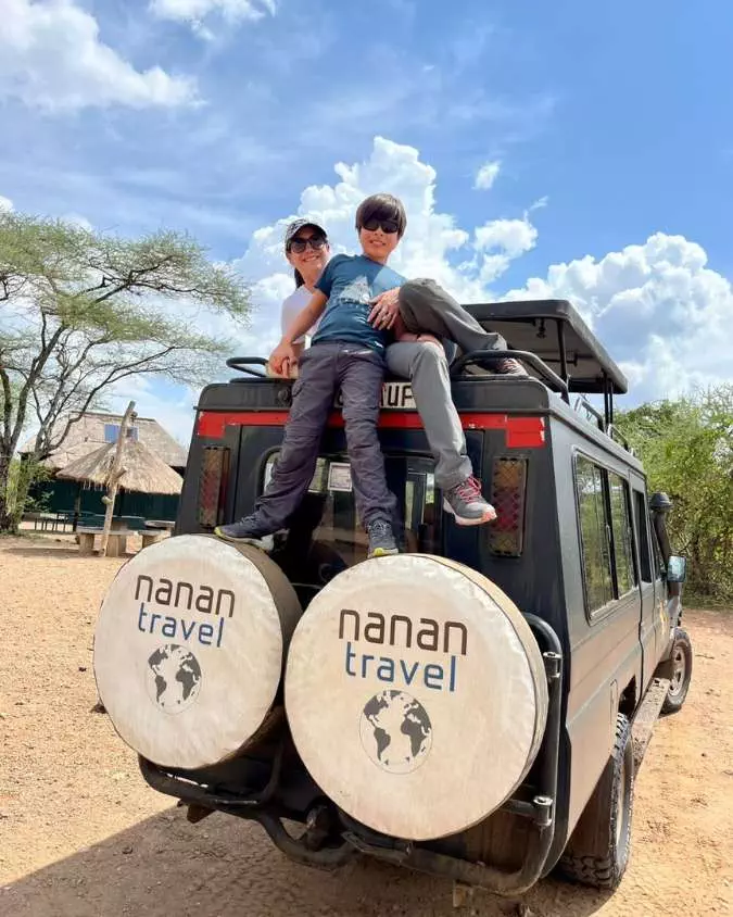 Nanan Travel - Family Luxury Safaris_ 5 Dream Destinations for All Ages - Tanzania (2) Nanan Travel - Balancing Luxury & Wilderness in African Safaris _ Ultimate Guide-German and Jan with meercats on safari in Botswana